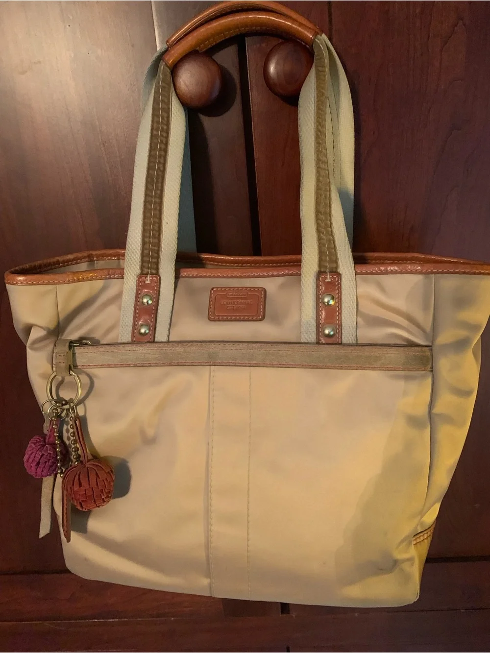 Coach Beige Tote with Tan Leather Trim and Pink/Burgundy Pom Charms